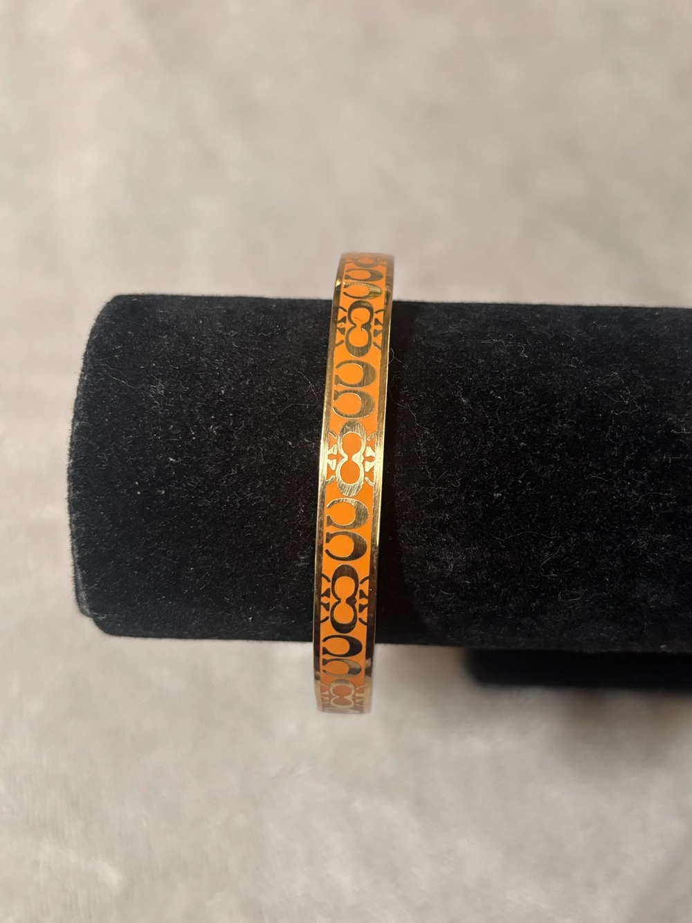 Coach Signature Enamel Orange and Gold Thin Bangle